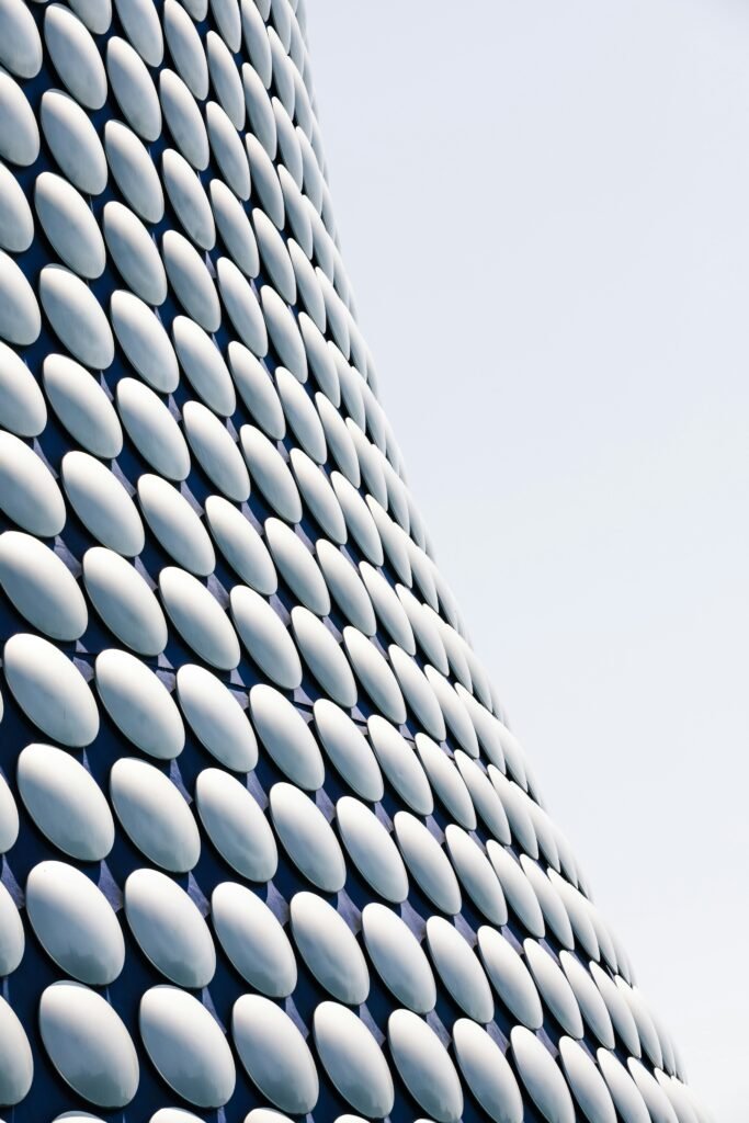 a close up of a building with a lot of white circles on it